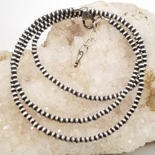 Navajo Pearl Serenade: 2mm Delicate Strand of Elegance