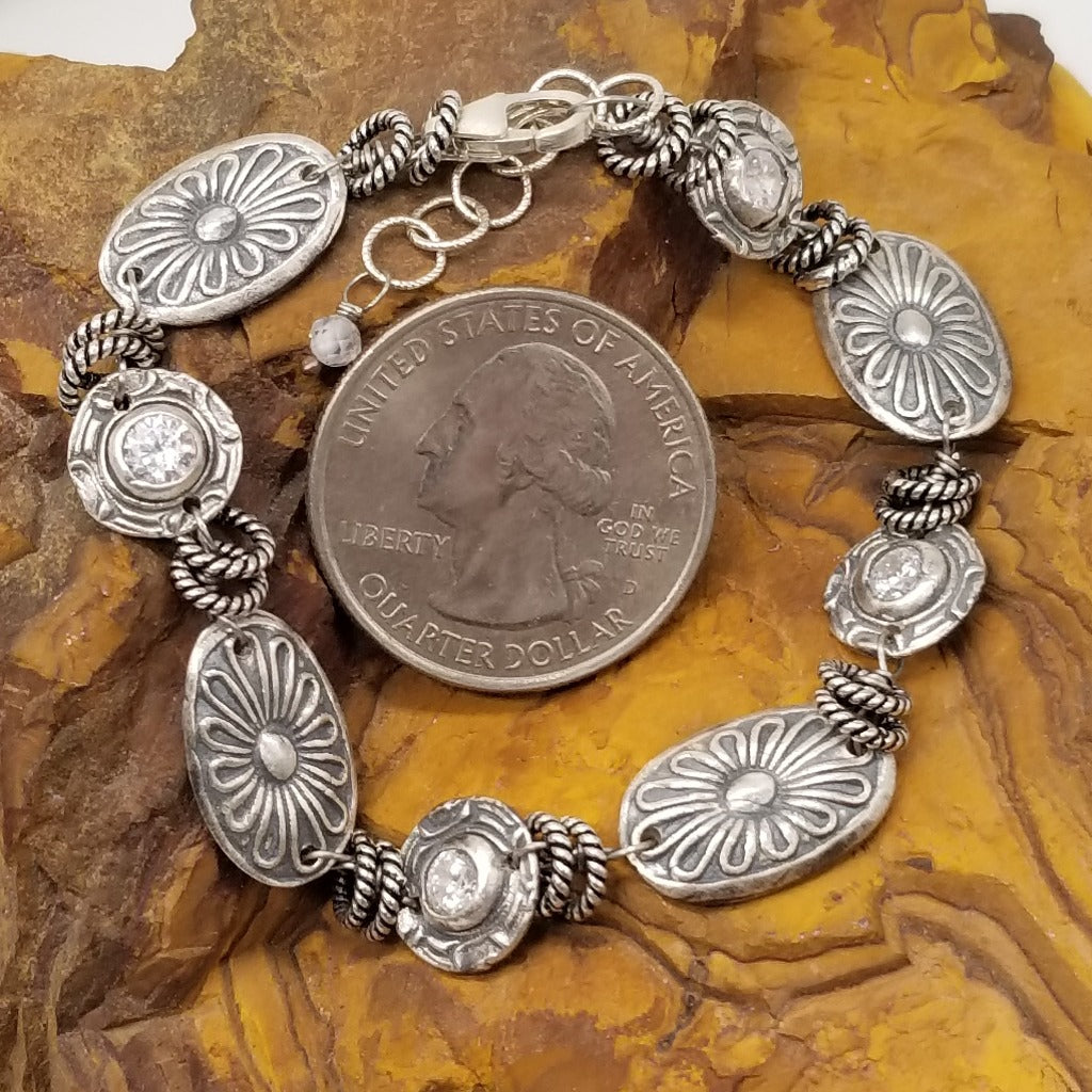 Southwest Radiance: Sterling Silver Concho Charm Bracelet